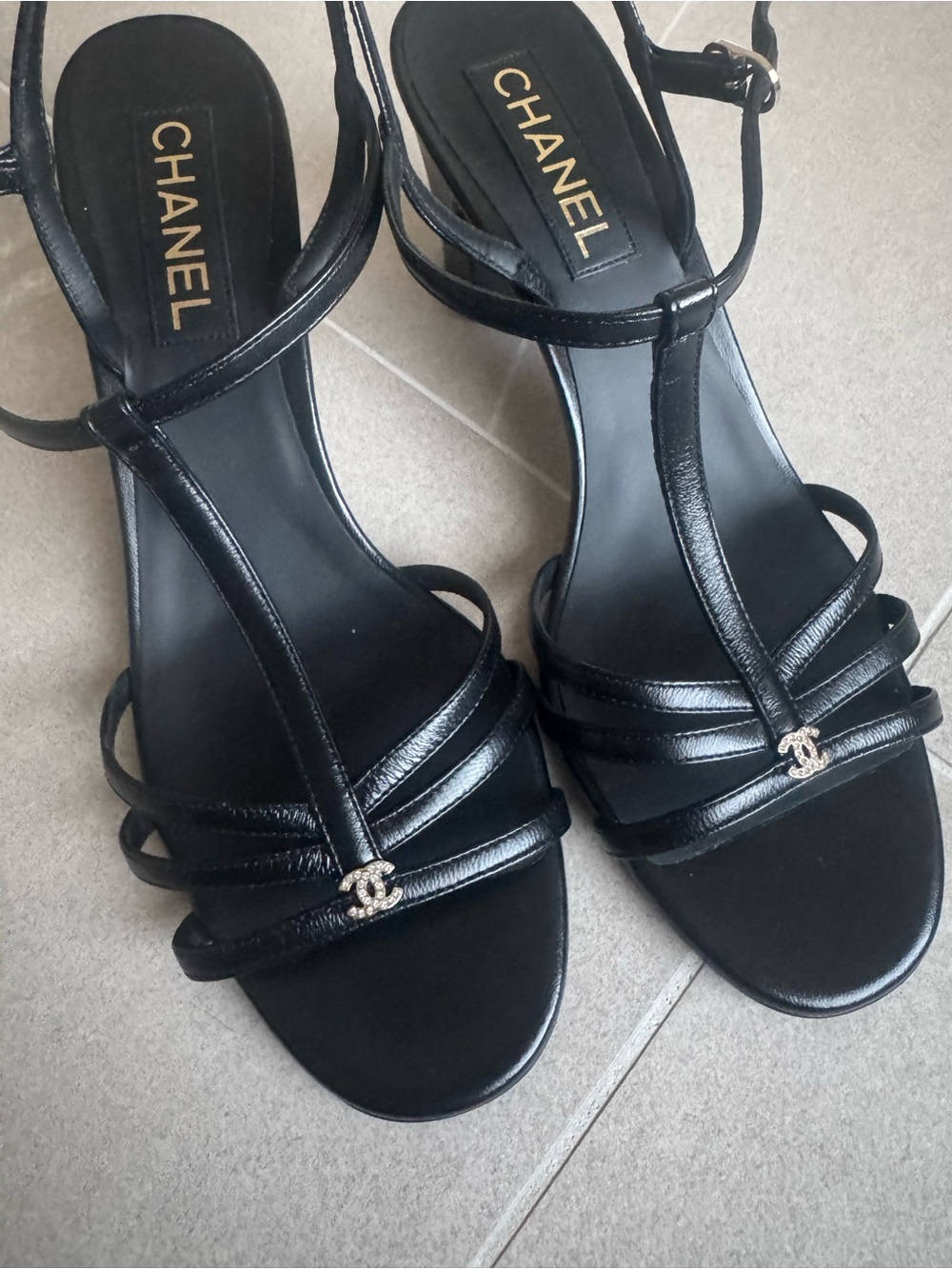 CHANEL Black Strappy T‑Bar Heeled Sandals with CC Accent